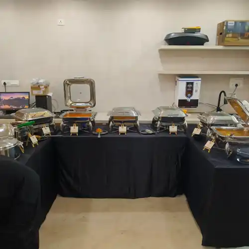 Indoor corporate lunch buffet setup at GlamFlame Studios in Begur